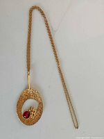 Full view of necklace showing chain and pendant