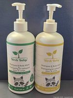 Front view of both Birch Baby Shampoo & Body Wash bottles showing green and yellow label variants
