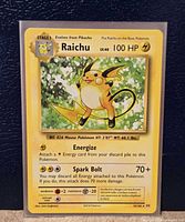 Front of Raichu card in sleeve