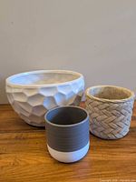 Group shot of all three planters showing relative sizes and finishes