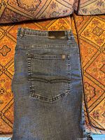 Back view showing pocket design and leather brand patch