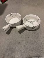 Two handled porcelain bowls top view showing interior and marble pattern