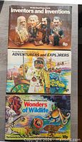 Front covers of all three Brook Bond albums stacked