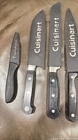 All four knives with sheaths displayed