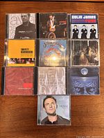 All 10 CD jewel cases laid out in grid