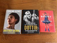 Front covers of all three hardcover memoirs