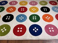 Full view of rug showing button pattern and edges