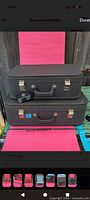 Two stacked hard-sided blue vinyl luggage pieces with handles and latch locks