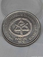 Obverse showing Habitat emblem, legend and date
