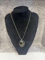 Necklace on display bust showing pendant and full chain