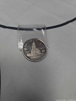 Obverse side showing church building and denomination