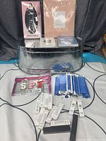 Full lot showing tub, cosmetics, curl set, keychains