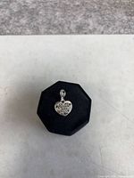 Front view of heart paw charm on display