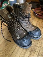 Full view of both boots showing uppers, laces, toe caps and CSA triangle