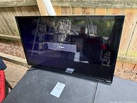 Front view of Vizio 32-inch TV displaying 'No Signal' message