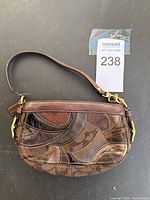 Front view of Coach patchwork handbag