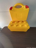 Closed view of carry case stacked on 8-stud storage brick