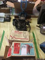 Image showing Craftsman router with Ryobi Handy Trimmer box and Craftsman Router Bit Sharpener box on table.