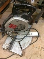 Full side angled view of the Elu PS 174 Type 2 chop saw sitting on a concrete floor.