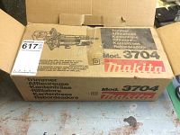 Closed original cardboard box for Makita Model 3704 trimmer showing branding and model number.