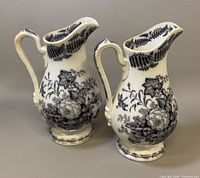 Front view of both matching earthenware pitchers