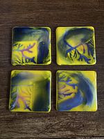 Four fused glass coasters showing top patterns