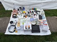 Full lot overview showing all kitchen items laid out on sheet