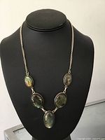 Front view of necklace on display bust