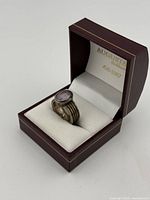 Ring in Augusta box angled view