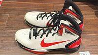 Side view of both shoes showing color scheme and Swoosh
