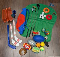 All items laid out showing variety of sports toys