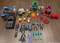All toys and figures laid out on floor
