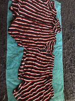 Full view of both pajama pieces laid out showing overall pattern and color