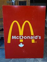 Full view of red McDonald's sign showing overall design and size