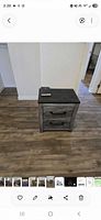 Front view of nightstand showing drawers and handles
