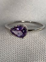 Full view of sterling silver ring with pear-cut amethyst