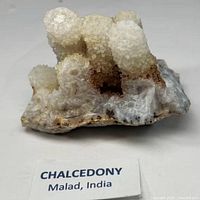 Front view of chalcedony cluster showing botryoidal formations and color