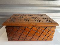 Closed box showing carved star lid and lattice sides