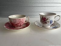 Both teacup and saucer sets side by side for overall view