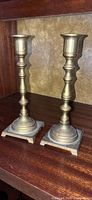 Pair of brass candlesticks full view