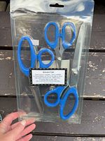 Front view of sealed package showing all three scissors