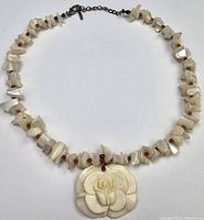 Full view of necklace showing pendant, shell chips, clasp