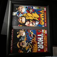 Both framed Thor comic cover prints within black frame/mats