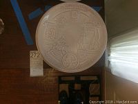 Frankoma pottery plate featuring Bicentennial Celebration embossed design with colonial symbols