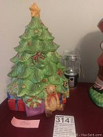 Ceramic Christmas tree cookie jar with base presents and teddy bear, next to mini LED lantern