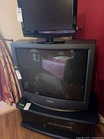 Front view of Panasonic 32-inch CRT TV with curved screen
