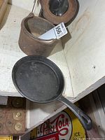 Top view showing small pot and skillet
