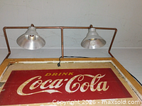 Top detail of copper tube and dual light fixtures