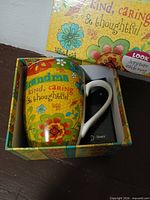 Mug inside box with floral graphics visible