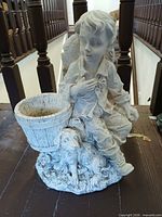 Front view showing boy, dog and bucket planter